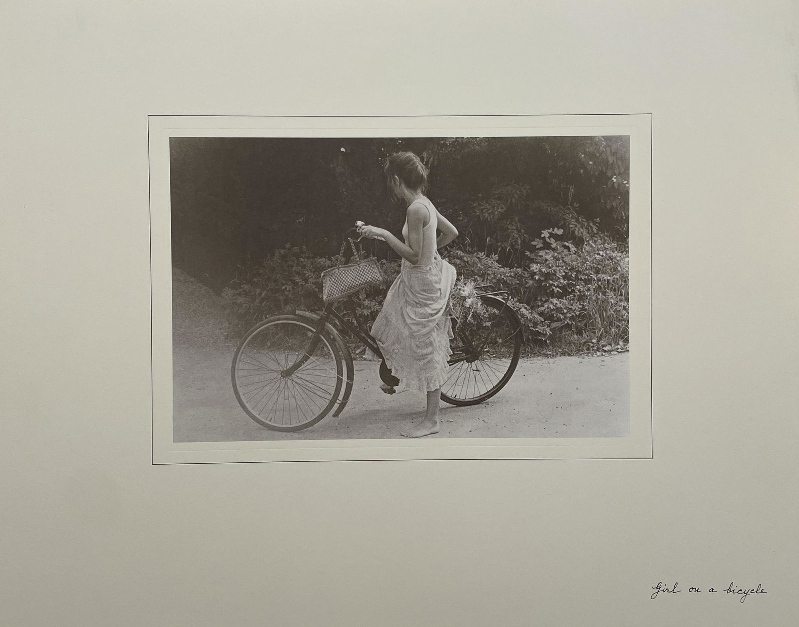 David Hamilton - Girl on a Bicycle: DAVID HAMILTON (1933-2016) Girl on a Bicycle Print in Colors 11 3/4" x 15" David Hamilton was a British photographer and film director known for his nude photographs of adolescent girls. Often controv