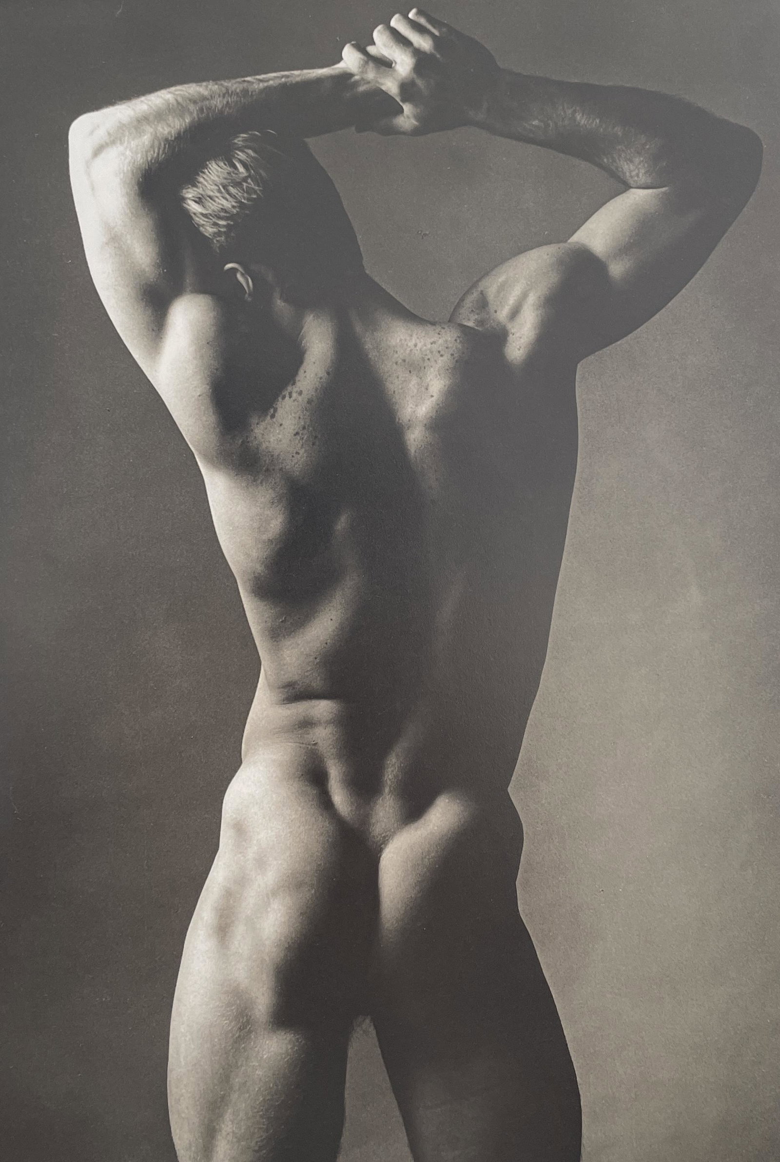 Ken Haak - Male Nude, 1986: KEN HAAK (1923-1991) Male Nude, 1986 Print in Colors 6 7/8" x 10" Ken Haak became a self-taught explorer in fashion photography who played light and shadow against skin and fabric to not simply dramat