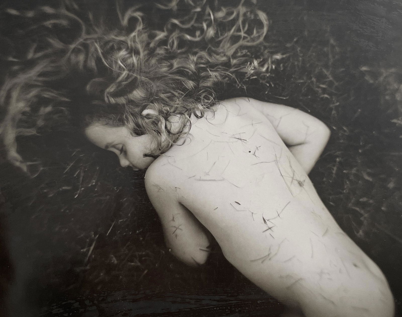 Sally Mann - Fallen Child, 1989: SALLY MANN (B.1959) Title - Fallen Child, 1989 Type of Print - Print in Colors Approximate Image Size - 9 1/2" x 8" Sally Mann is an American photographer known for her black-and-white portraits of he