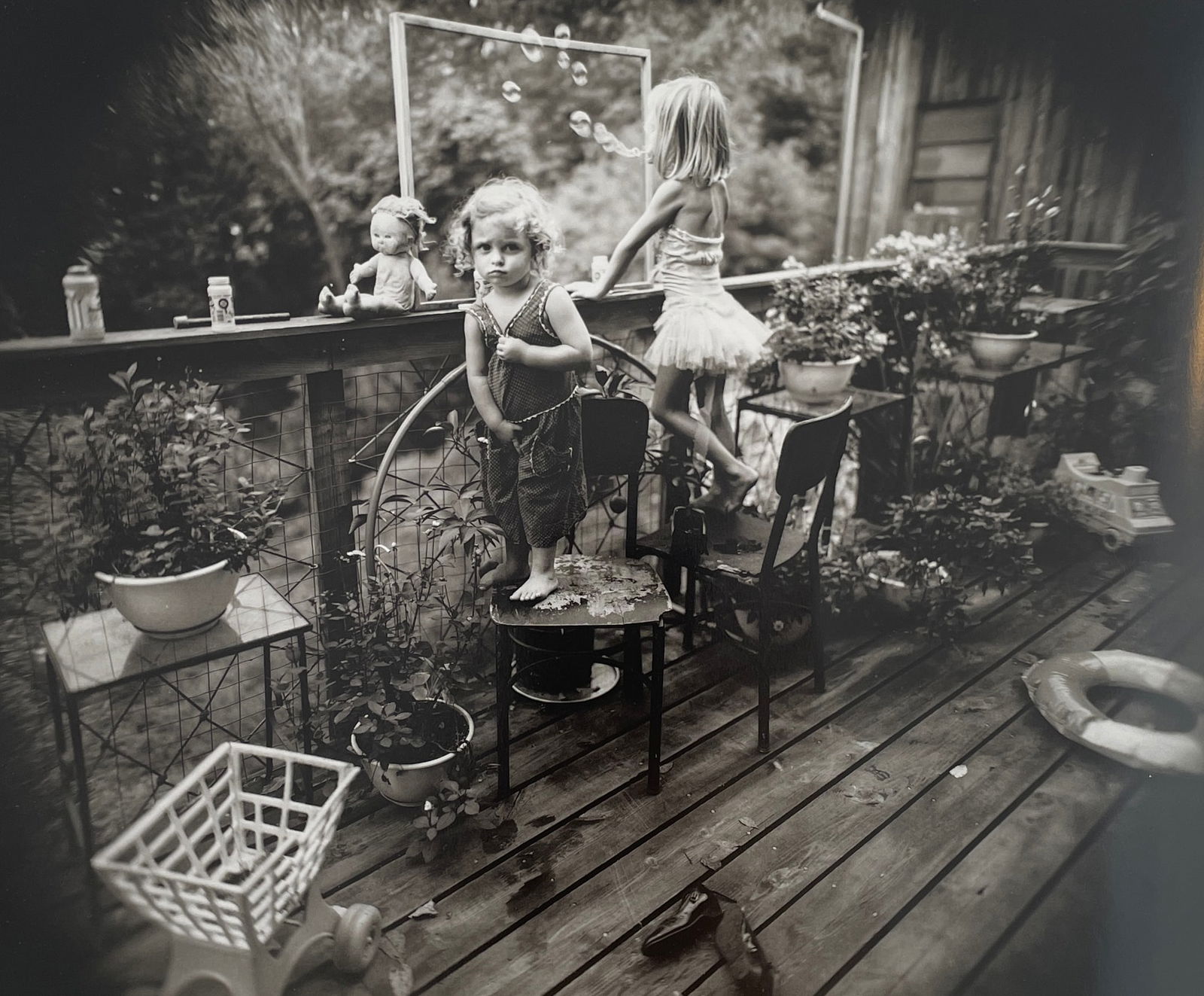 Sally Mann - Blowing Bubbles, 1987: SALLY MANN (B.1951) Title - Blowing Bubbles, 1987 Type of Print - Print in Colors Approximate Image Size - 9 3/4" x 8" Sally Mann is an American photographer known for her black-and-white portraits of