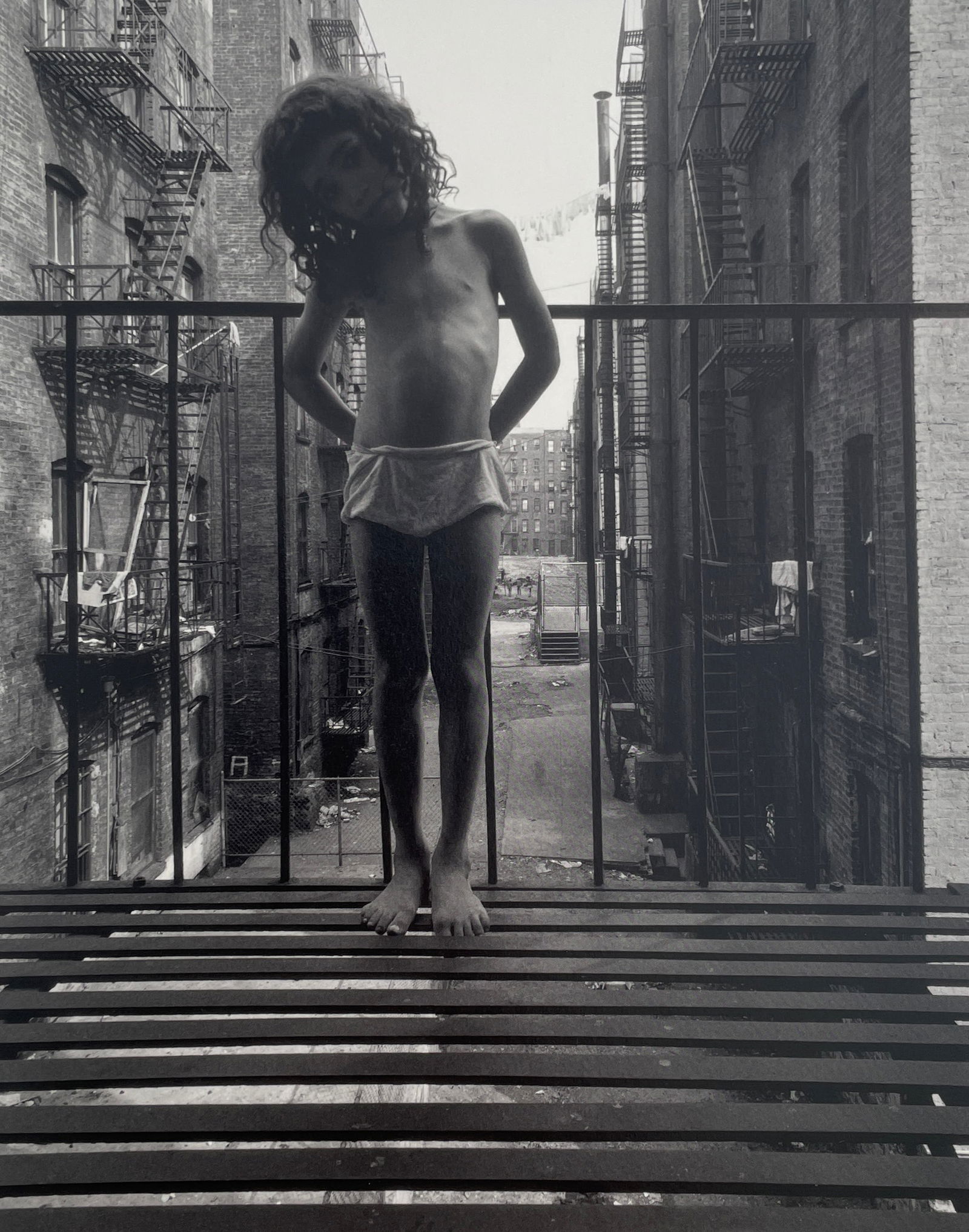 Bruce Davidson - East 100th St, 1966: BRUCE DAVIDSON (B.1933) Title - East 100th Street, 1966 Type of Print - Print in Colors Approximate Image Size - 9" x 7" Bruce Davidson is an American photographer known for capturing images of commun