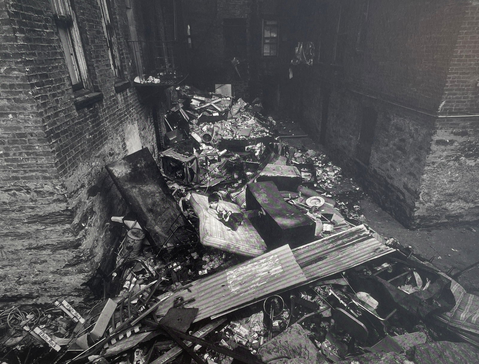 Bruce Davidson - East 100th St, 1966: BRUCE DAVIDSON (B.1933) Title - East 100th Street, 1966 Type of Print - Print in Colors Approximate Image Size - 9 1/2" x 7 1/2" Bruce Davidson is an American photographer known for capturing images o