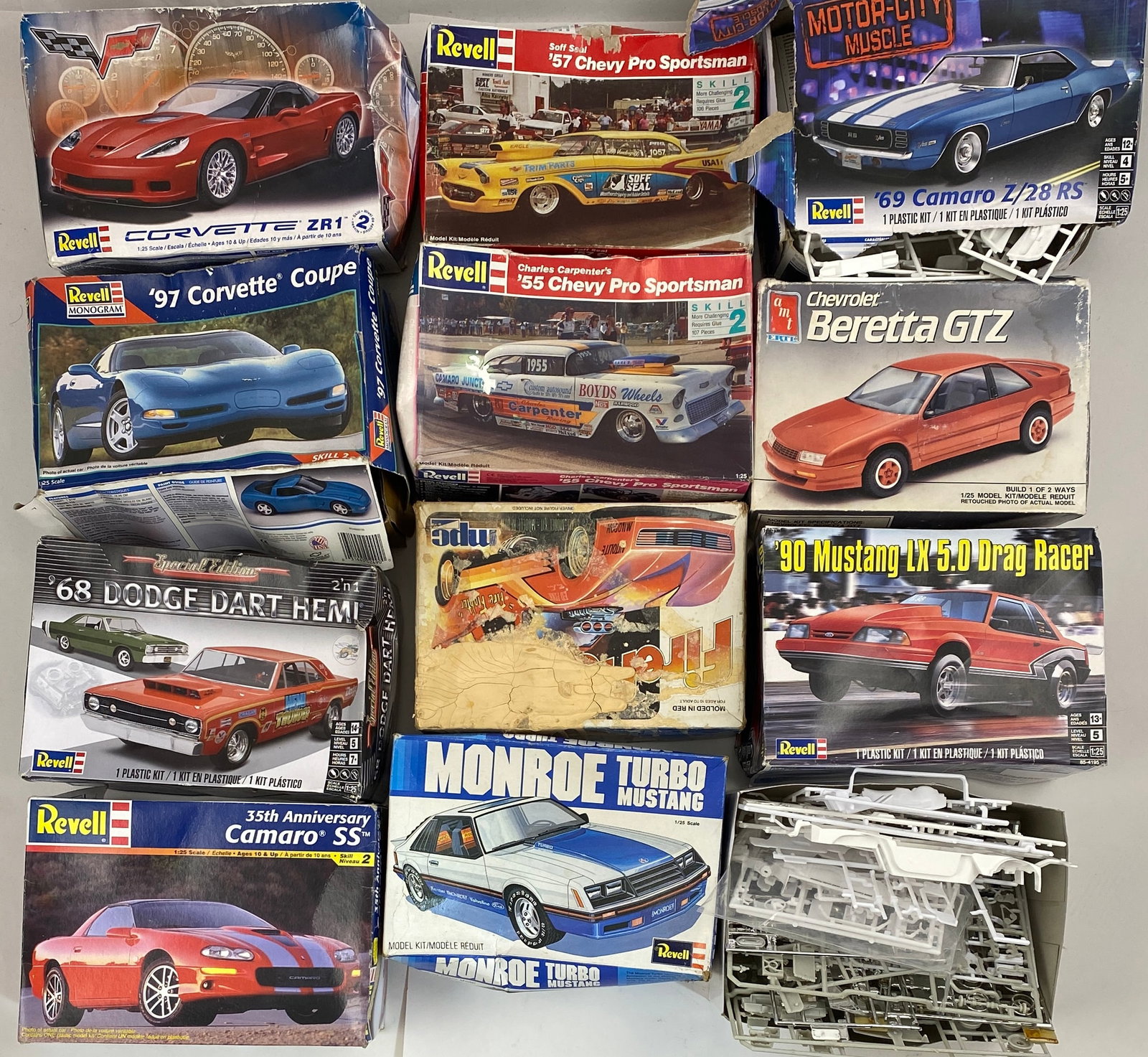Grouping of 12 Revell Car Models w/ Boxes: REVELL Grouping of 12 Vintage Car Models Each measure approximately 9" x 4" x 6"