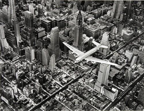 Margaret Bourke-White - DC-4 Flying Over Manhattan, 1939: MARGARET BOURKE-WHITE (1904-1971) DC-4 Flying Over Manhattan, 1939 Print 7" x 9"