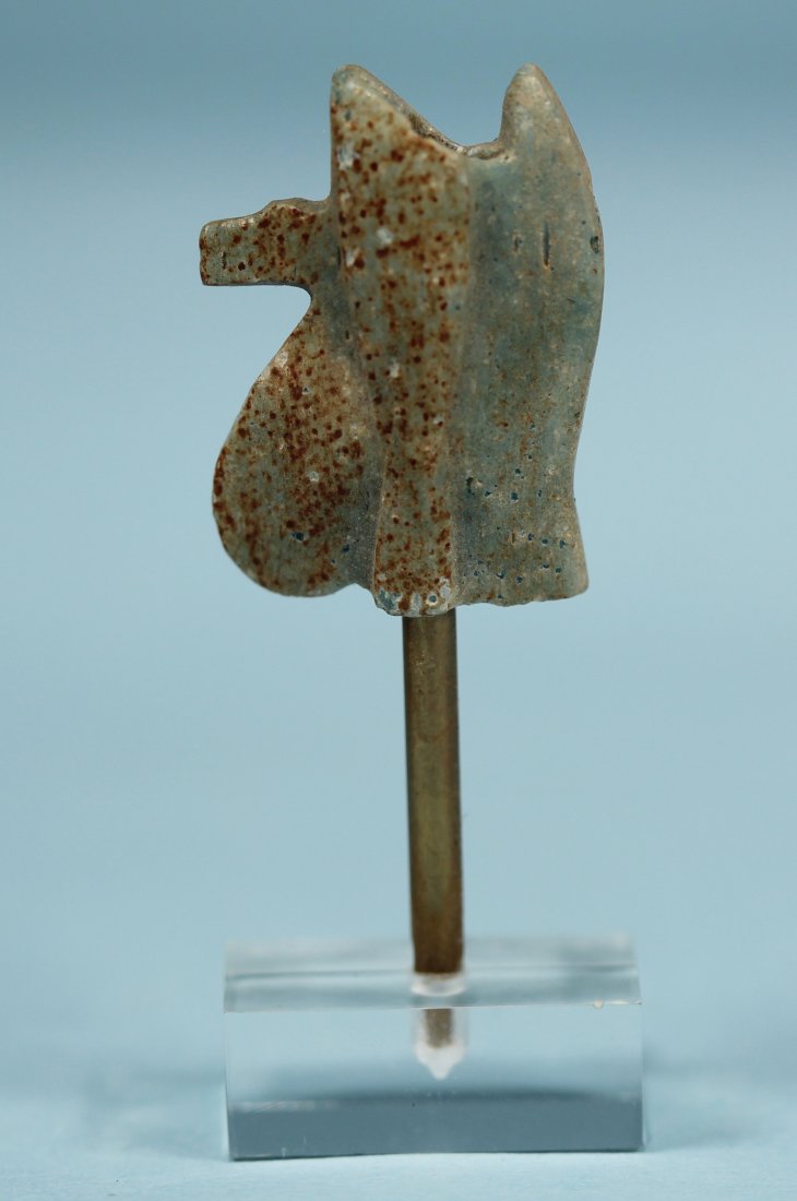 EGYPTIAN FELDSPAR WEDJAT EYE AMULET: An ancient Egyptian green feldspar amulet in the form of a wedjat eye. Late Period, ca. 700-30 BC. Length: 20 mm. Drilled through for suspension. The Wedjat eye represents the eye of the falcon god Ho