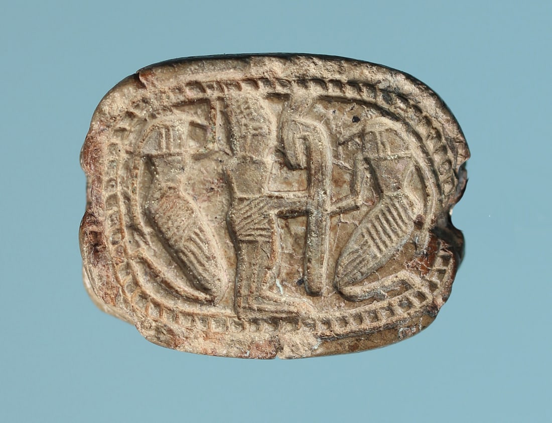 Egyptian Inscribed Plaque: An ancient Egyptian steatite inscribed plaque bearing images of a god flanked by women on one side, and a figure flanked by a falcon and a person on the other.New Kingdom, 18th Dynasty.Ca. 1411-1375 B