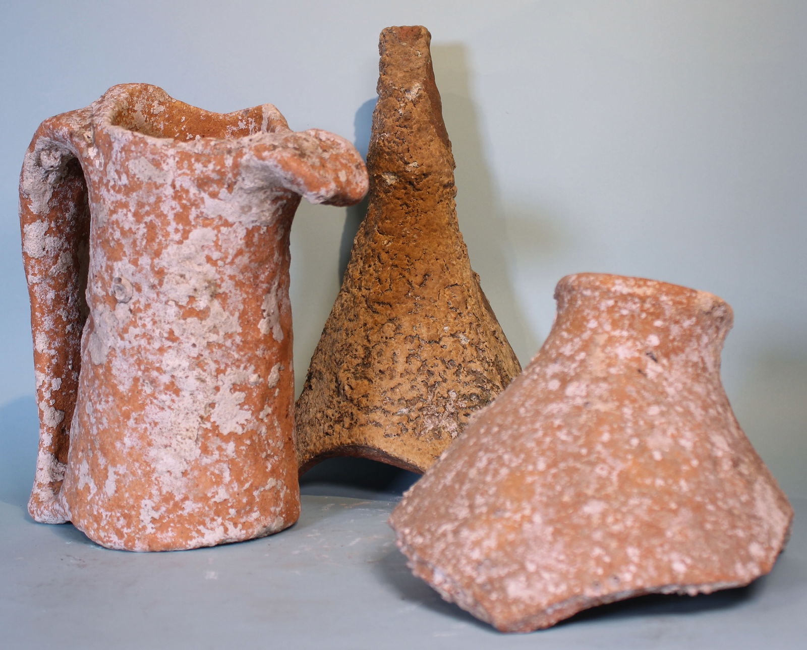 Three Roman Shipwreck Amphora Fragments: Three ancient Roman terracotta transport amphora fragments with marine incrustations, from a shipwreck.Ca. 1st - 4th century AD.Maximum height: 12 in. (30.5 cm).Formerly in a German private collection