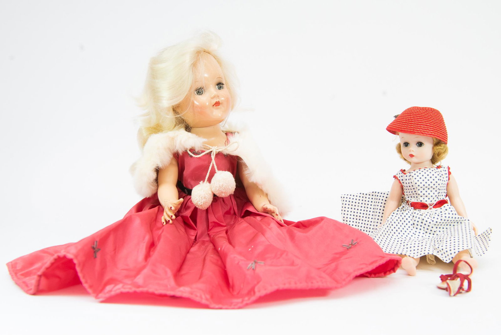 Vintage Toy Dolls: This lot features (2) Vintage Toy Dolls. The larger doll is marked Ideal, and the smaller one is unmarked. Size L-15"T S-9"T Condition Good Condition