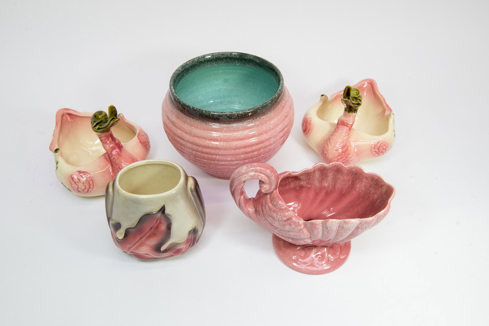 Assorted Hull Pottery: This lot features (5) pieces of antique pottery. (3) are marked by Hull and the other (2) are believed to be Hull or similar. Size Largest is 6''T 8''Diameter Condition Various Conditions