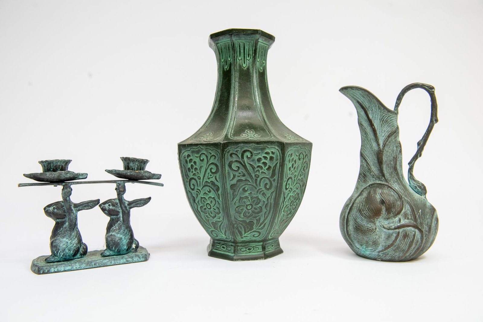 Art Nouveau Pitcher, Vase, & Candle Holder: This lot features (3) cast bronze Art Nouveau style pieces including a pitcher, vase, and candle holder. The large vase is signed/marked. Size Vase 11''T, Pitcher 8''T, Candle Holder 5''x5'' Condition