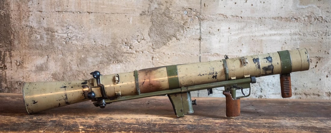 DEMILLED 84MM M2 CARL GUSTAF RECOILLESS RIFLE: A demilled 84mm M2 Recoilless Rifle designed by Carl Gustaf of Sweden. Introduced in 1964, this launcher was able to utilize a variety of ammunition types from smoke grenades, flares, and anti-tank ro