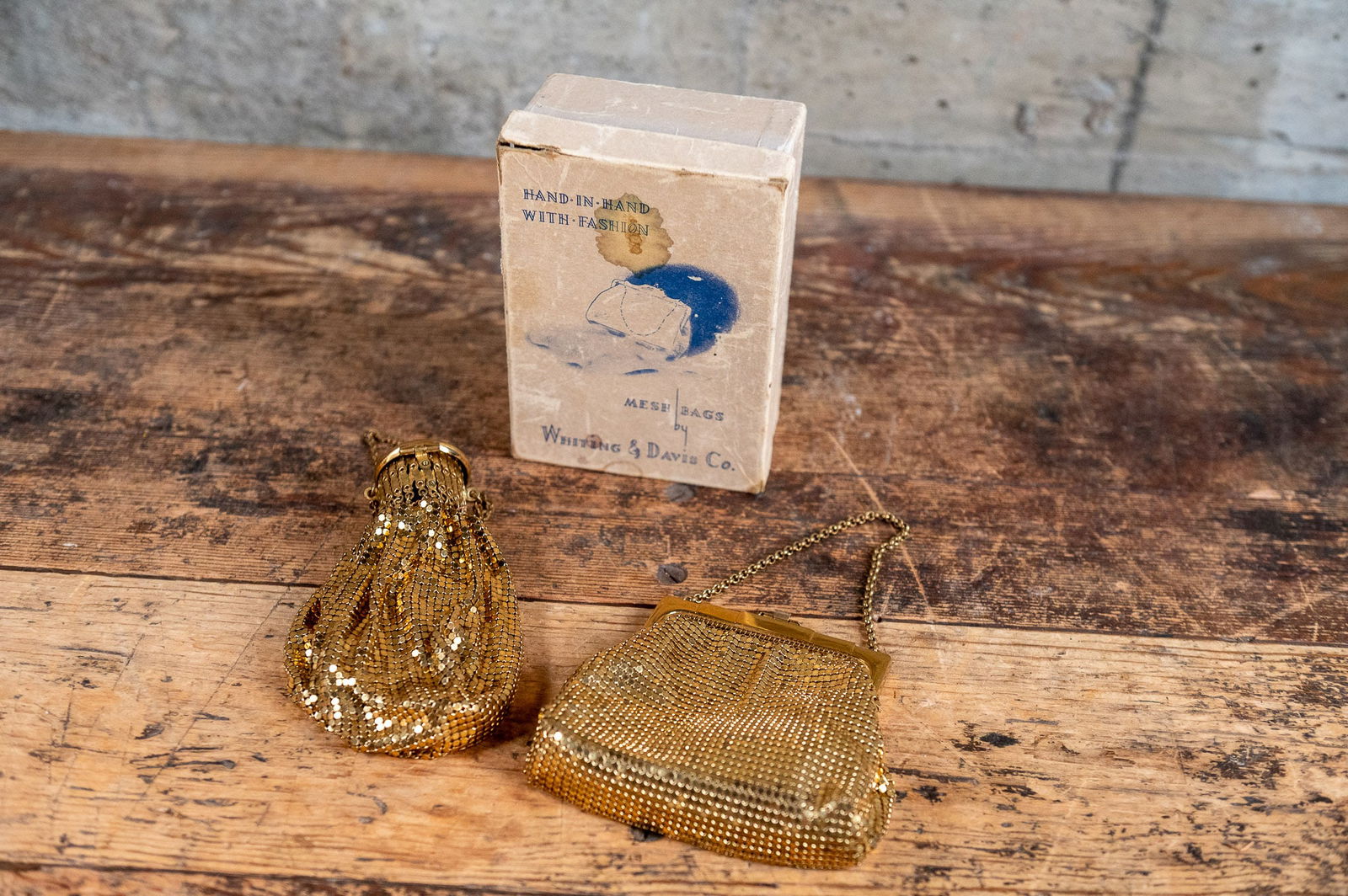 MESH BAGS BY WHITING & DAVIS CO.: This lot features a set of antique mesh bags in original box by Whiting & David Company. Whiting & Davis is an American company that manufactures mesh handbags and other metal mesh products. T