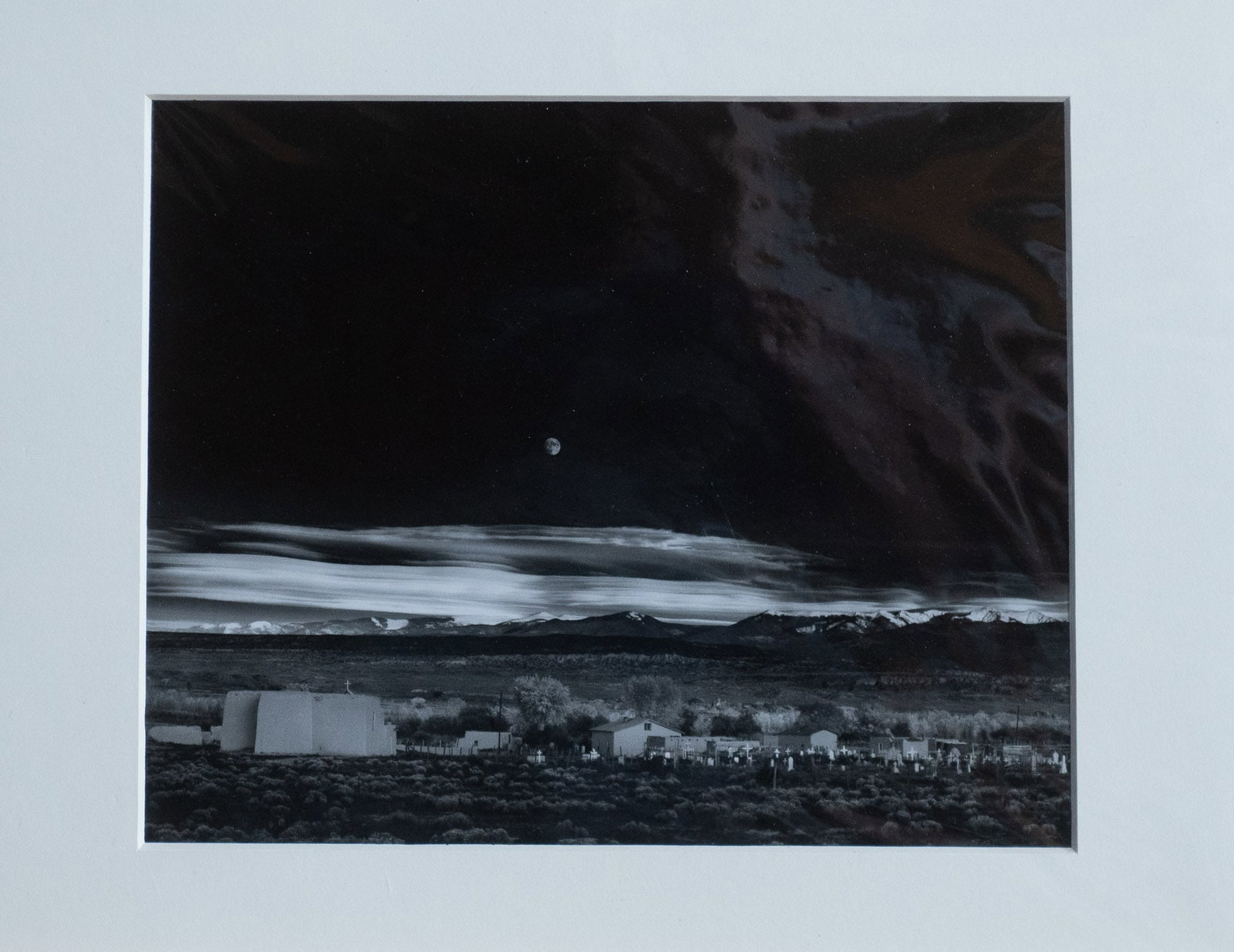 ANSEL ADAMS, "MOONRISE": "Moonrise" a silver photograph by listed photographer Ansel Adams. An authorized edition purchased directly from gallery. Ansel Adams was an American photographer who was born in 1902 and passed in 19