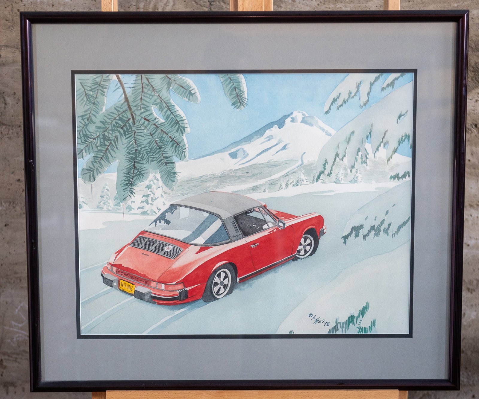 ALAN NIES, "PORSCHE & A NIKON IN OREGON": "Porsche & a Nikon in Oregon" original watercolor by listed artist, Alan Nies. Includes a photograph of Nies on the back taken by master photographer, Richard Stefani. Measures in frame, 27.25'' H