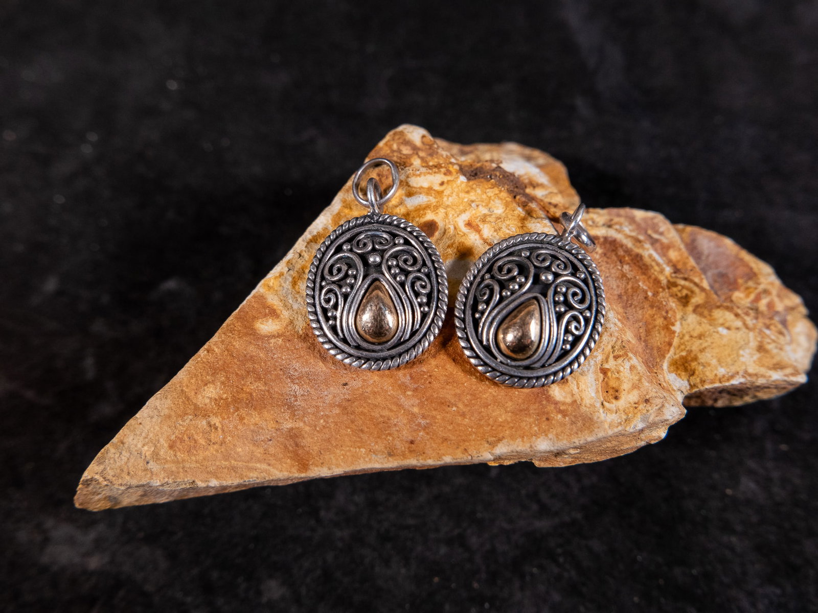 18K GOLD & STERLING SILVER PENDANTS, SUARTI, BALI, INDONESIA: A pair of pendants made of 18K gold on top of sterling silver, made by Suarti of Bali, Indonesia. The reverse of each pendant is marked "925 BA 18K INDONESIA". Total weight of both pendants is 5.0 g.