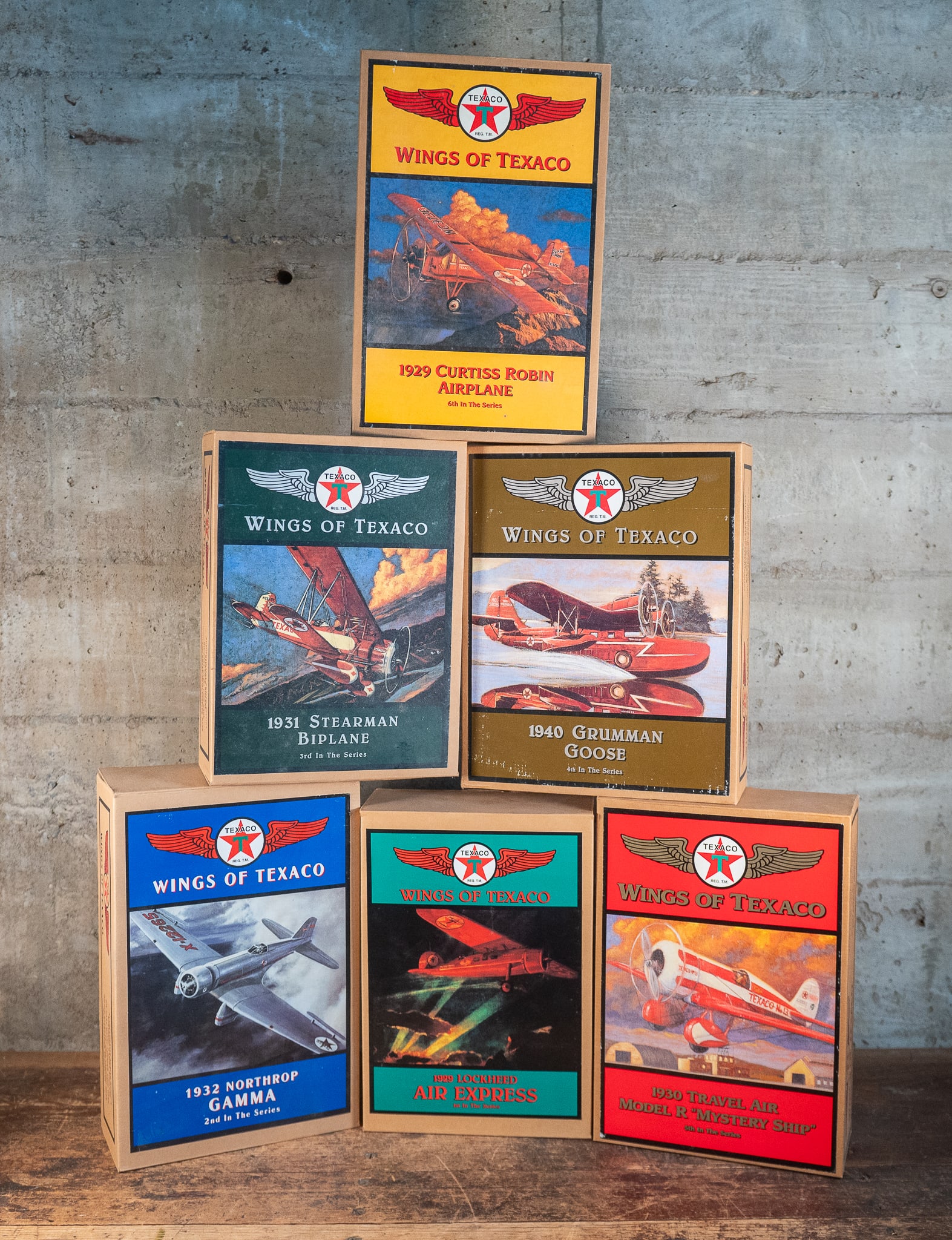 WINGS OF TEXACO DIE-CAST MODELS: A collection of die-cast models titled, "Wings of Texaco" in original packaging.