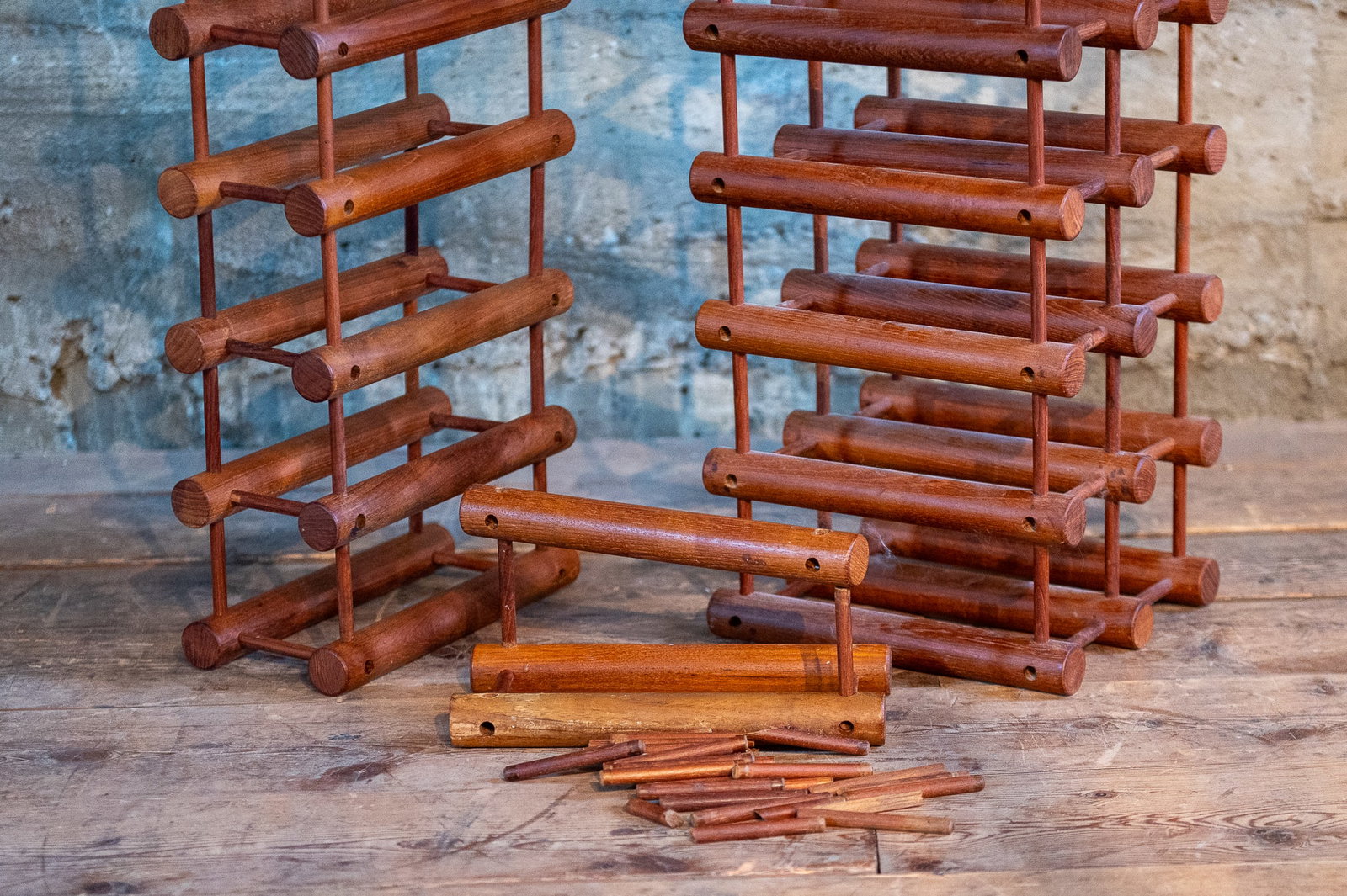 NISSEN LANGAA DANISH TEAK WINE RACKS: A beautiful modular set of teak wine racks by Nissen Langaa in Denmark. You can set these up any way you would like and extra components are included, ready to be customized how you would like! Richar