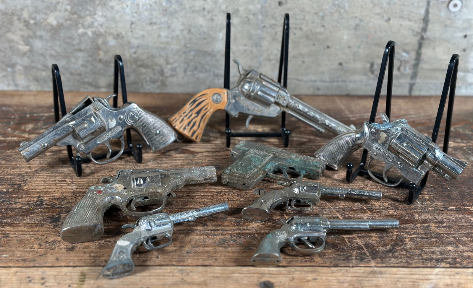 ANTIQUE CAP GUN COLLECTION: A collection of antique cap guns including ones titled, Wyatt Earp, Trooper, Dick, Kilgore, & Hubley. All are in various conditions, please see photos.