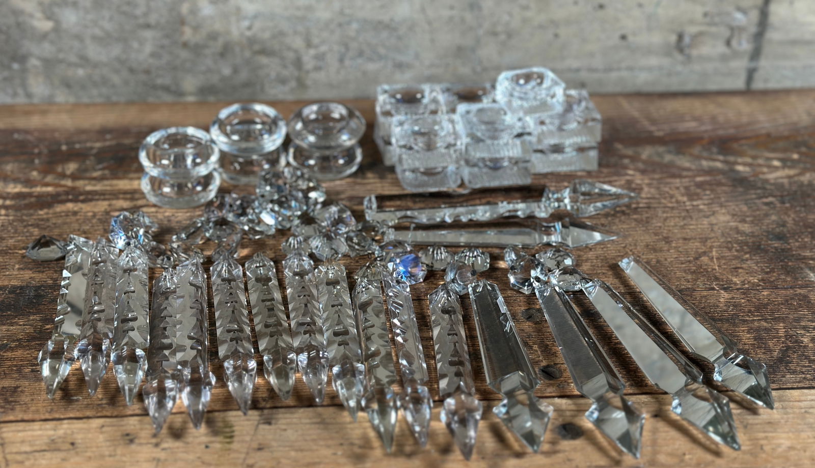 GLASS PRISMS, DROPS, & SALT CELLARS: A collection of antique glass prisms and drops from mantle lusters & seventeen salt cellars. The salt cellars all appear to be in excellent condition. The glass prisms and drops are in various con