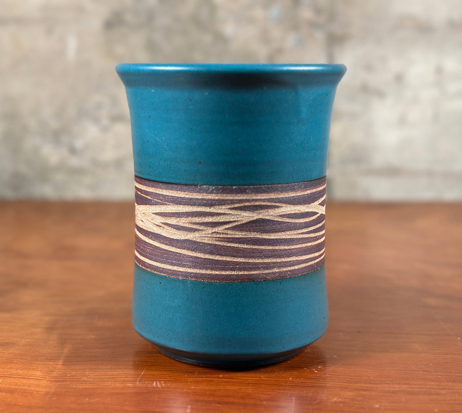 VICTORIA LITTLEJOHN, STUDIO POTTERY VASE #2: A studio pottery vase by listed artist, Victoria Littlejohn. Signed on the bottom and measures 7'' H x 5.5'' W x 5.5'' D. Victoria Littlejohn produced both production and one-of-a-kind work. Her