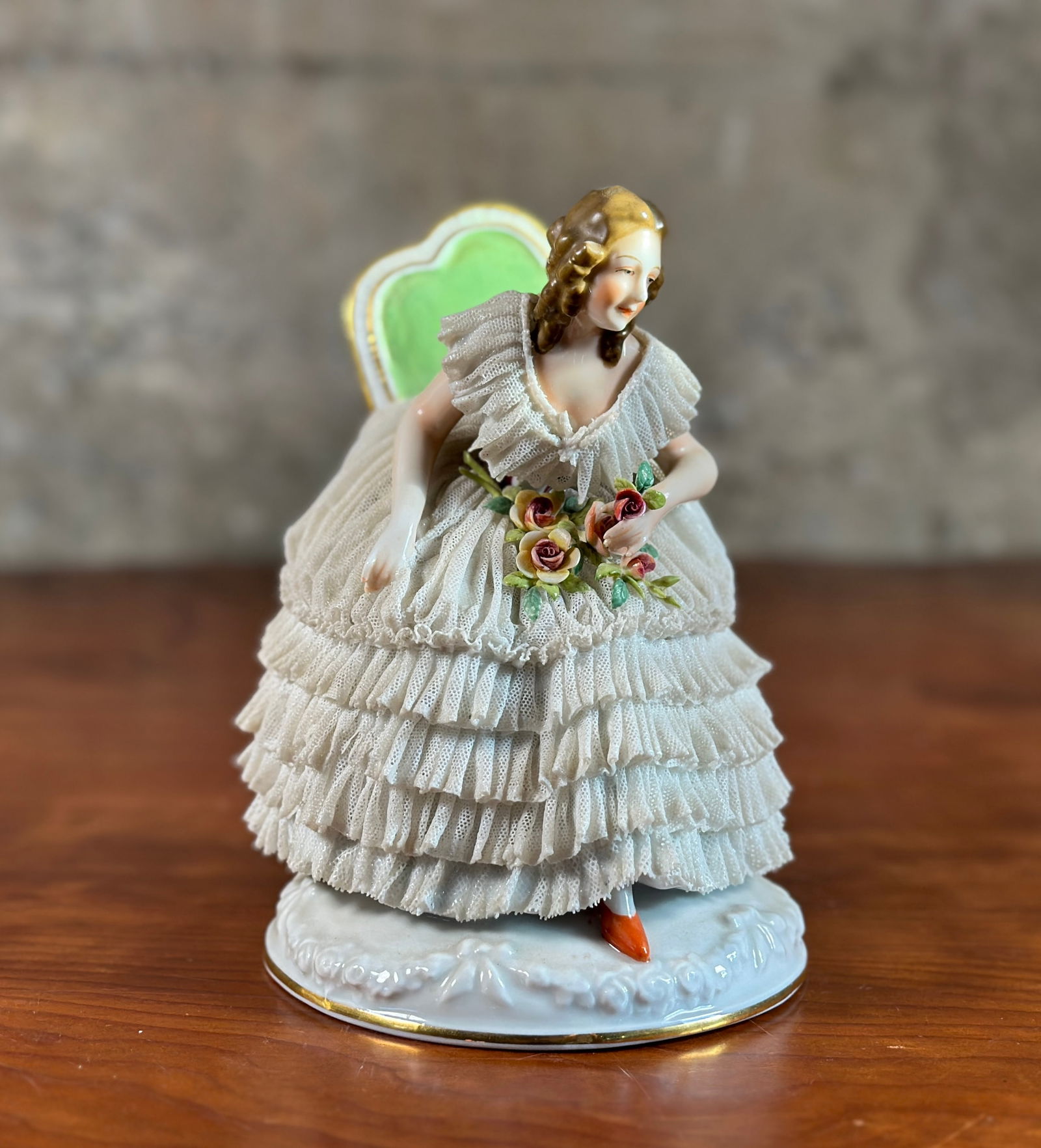 CAPODIMONTE PORCELAIN, GERMANY: A Capodimonte porcelain sculpture with maker marks underneath as shown in photos. This piece appears to be in very good condition overall and measures 6.25” H x 5.25” W x 5” D. From