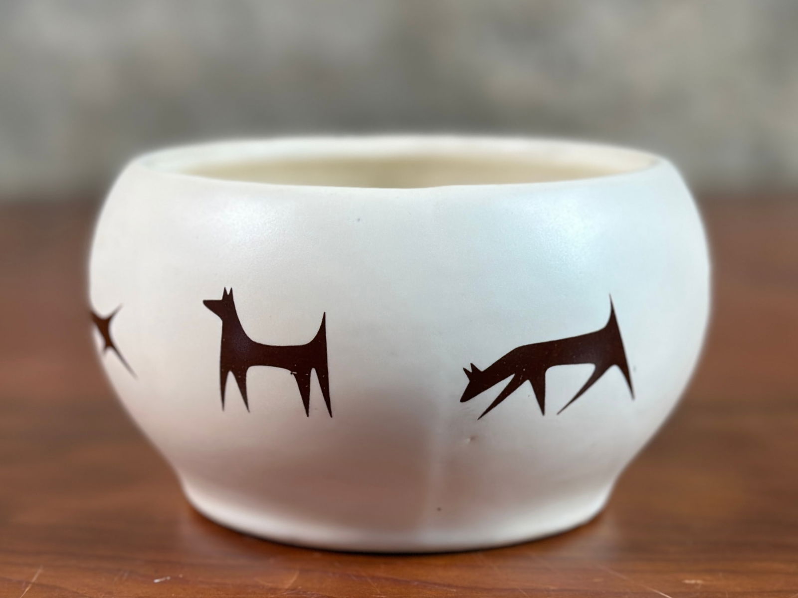 MCCOY & UPJOHN UNIPET TREAT CONTAINER: A McCoy & Upjohn Unipet ceramic treat container with maker mark underneath as shown in photos. This piece measures, 3'' H x 5'' W x 5'' D. McCoy and Upjohn Unipet refers to a line of vintage ceram