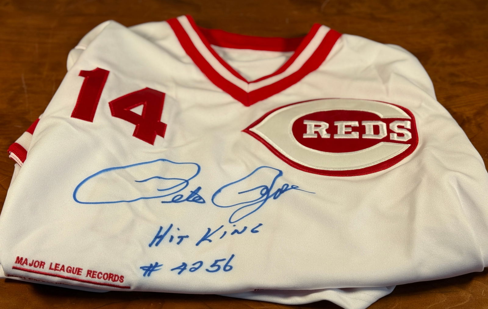 PETE ROSE SIGNED JERSEY: A signed jersey by American baseball player and manager, Pete Rose. Signed by both his given name and "Charlie Hustle". The jersey is also limited edition, numbered 246/500. Peter Edward Rose Sr., nic