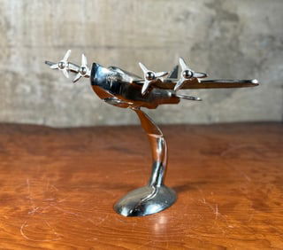 FOUR-ENGINE PROPELLER-POWERED SEAPLANE CHROME SCULPTURE