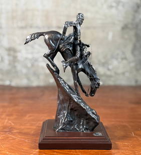 FREDERIC REMINGTON, 'THE MOUNTAIN MAN': &quot;The Mountain Man&quot;, a bronze sculpture by listed artist, Frederic Remington. It depicts a buckskin-clad Iroquois trapper and his horse navigating a steep, rocky slope, capturing a moment of