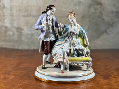 CAPODIMONTE, PORCELAIN FIGURE OF LOVERS: This lot features a porcelain sculpture figure of lovers, manufactured by Capodimonte with maker mark underneath as shown in photos. This sculpture measures, 9.5'' H x 8'' W x 6'' D. Capodimonte porce