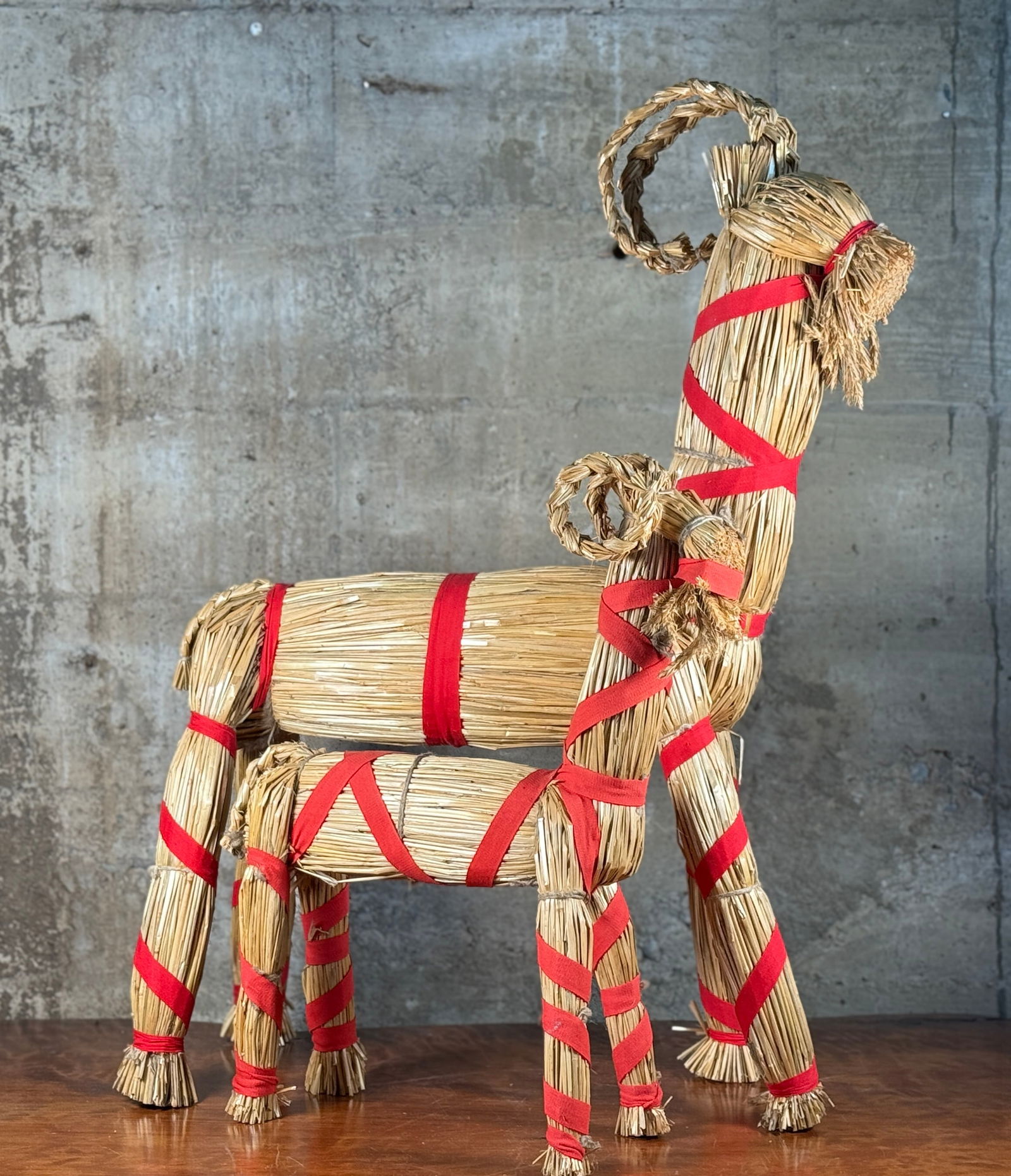 PAIR OF SCANDINAVIAN STRAW YULE GOATS: This lot features a pair of Scandinavian straw yule goats. The largest measures, 32” H x 22” W x 12” D. The straw Yule Goat is (or was, now it’s a decoration) a “skördebock&rdqu
