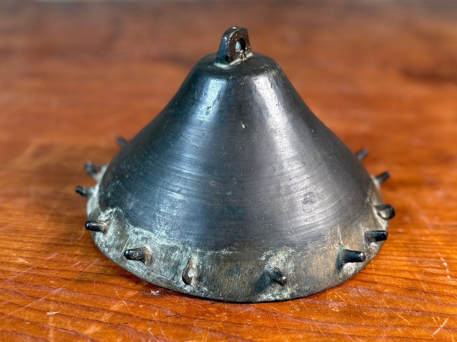 19TH CENTURY BRONZE ISLAMIC HAWKING DRUM: This lot features a 19th century bronze Islamic hawking drum in good overall condition for its age and has a bell that has been attached. This hawking drum measures, 4'' H x 6.5'' W x 6.5'' D.