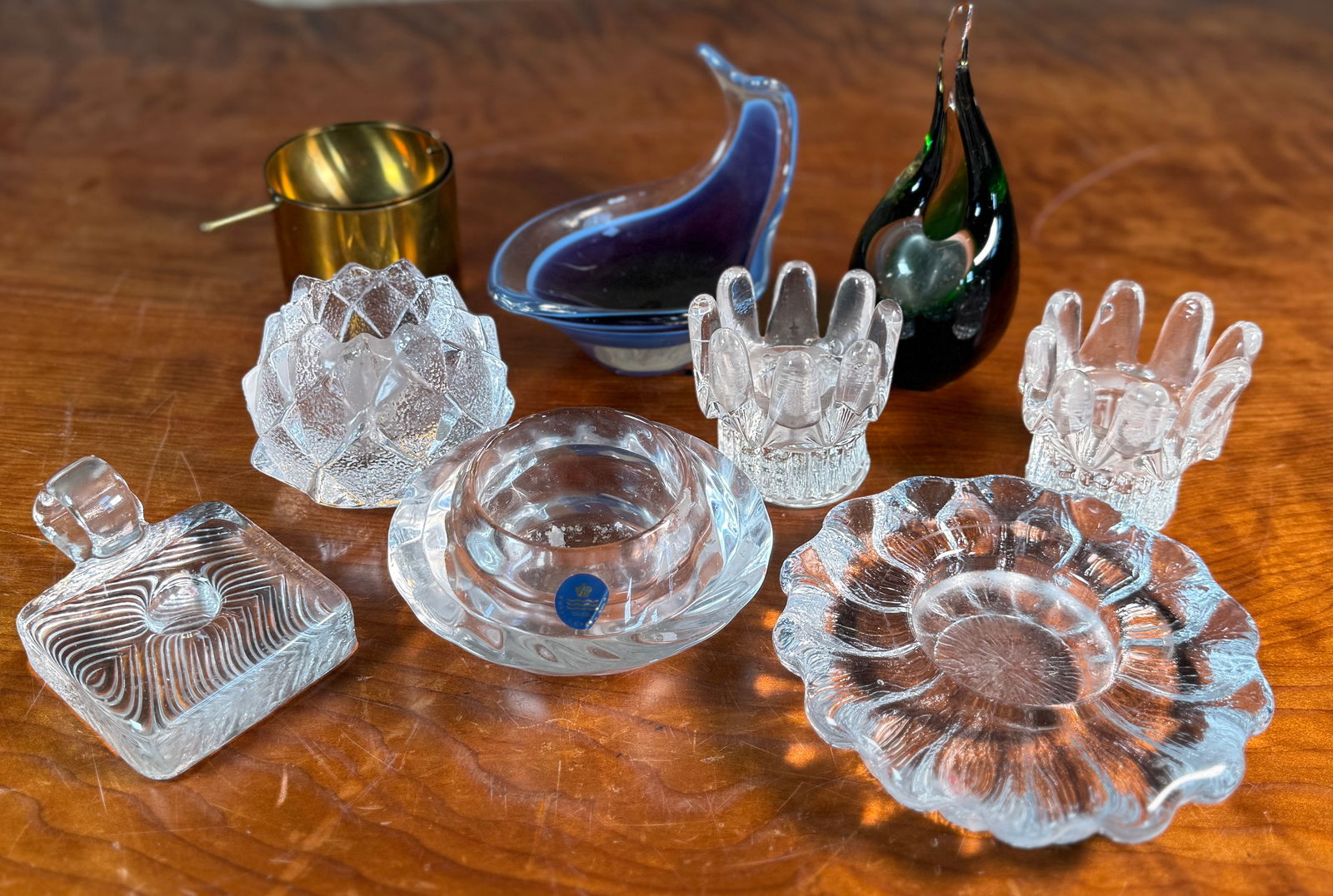 MID-CENTURY GLASS & CRYSTAL COLLECTION: This lot features a collection of primarily mid-century glass & crystal candle holders, vases, and more. Makers include Royal Copenhagen, Orrefors, Holmegaard, and more.