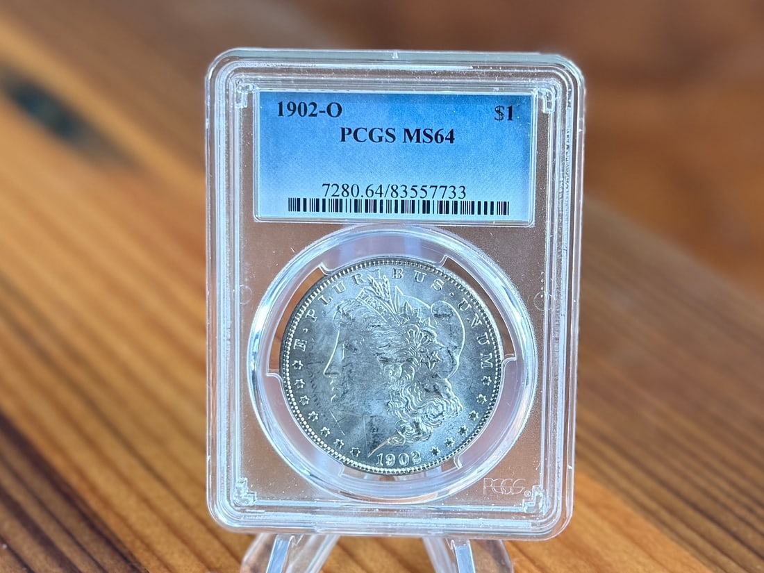 1902-O MORGAN DOLLAR, PCGS MS64: This lot features a slabbed PCGS MS64 1902-O Morgan dollar.