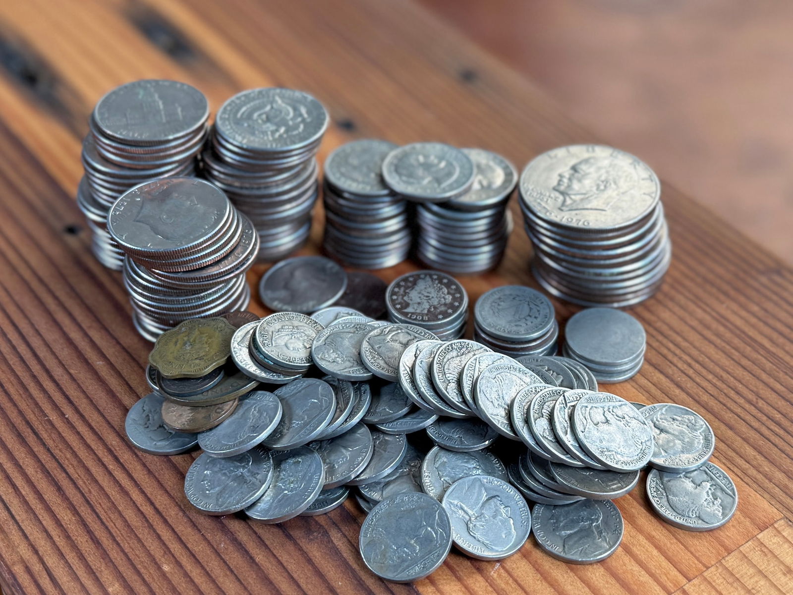 LARGE COIN COLLECTION: This lot features a large coin collection with fifty-five (55) Kennedy half dollars, twenty-five (25) Susan B. Anthony dollars, fourteen (14) V nickels, eleven (11) Eisenhower dollars, and a handful