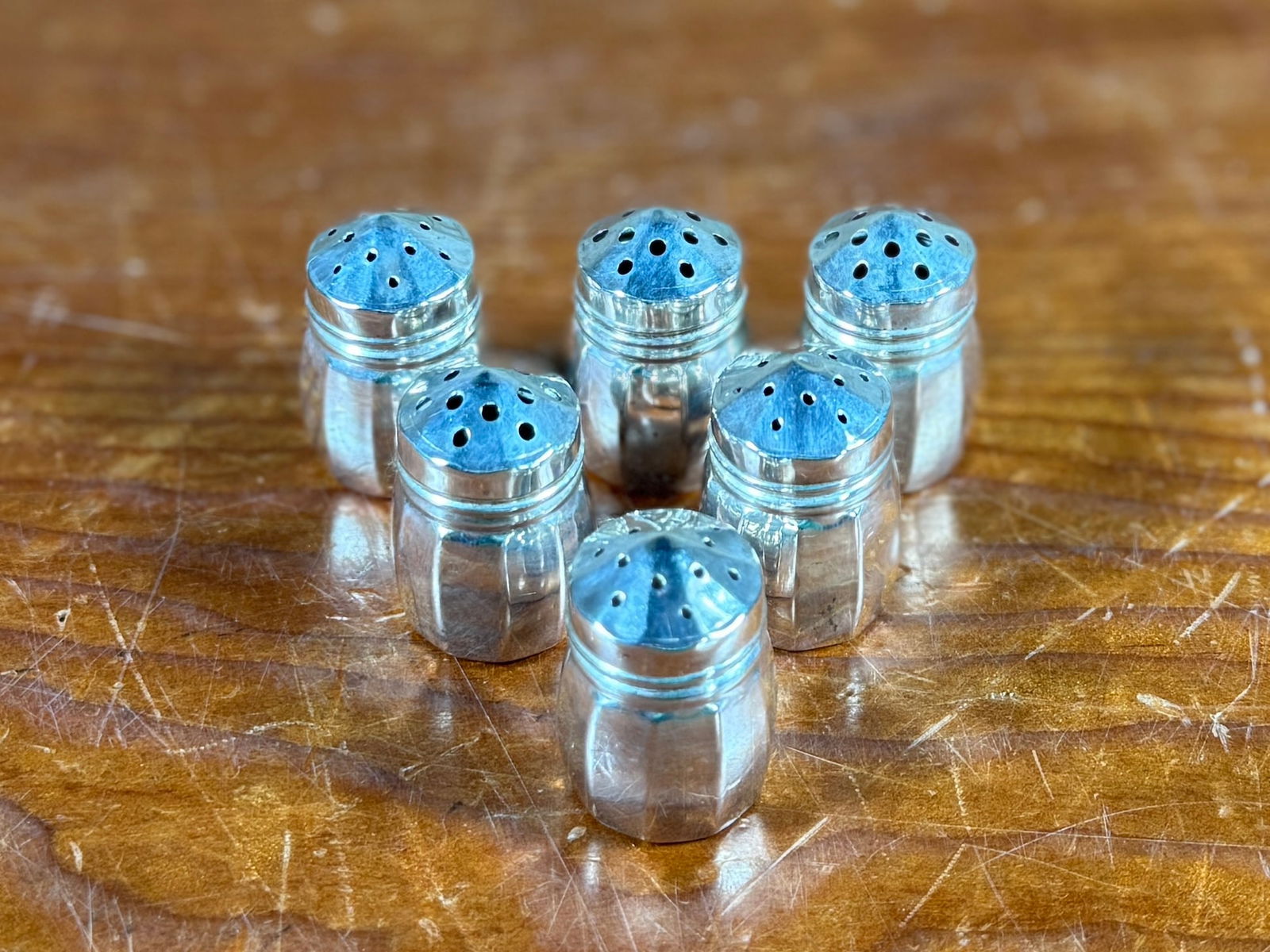 STERLING SILVER SALT & PEPPER SHAKERS: This lot features a set of six (6) antique salt and pepper shakers, beautiful polished and made of sterling silver with a total approx. weight of 23.00 grams.