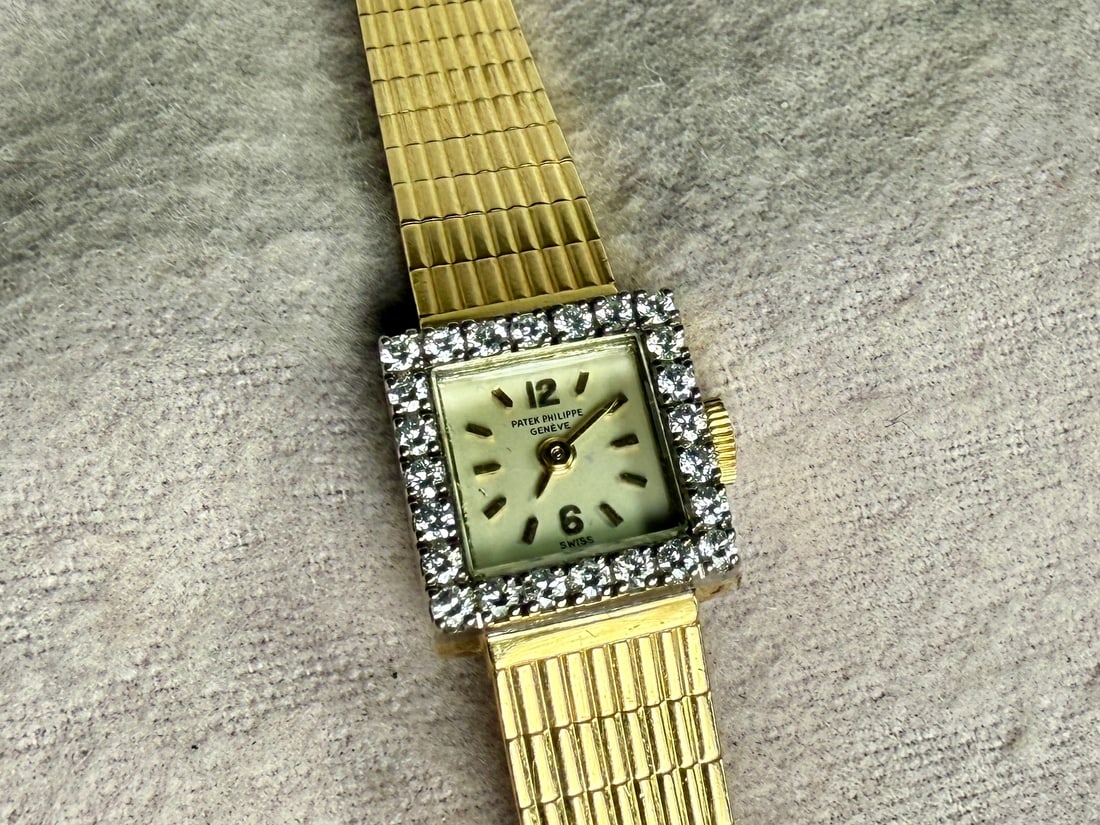 PATEK PHILIPPE, 18K GOLD & DIAMOND WATCH: This lot features an incredible 18k gold and diamond watch by Patek Philippe. Watch reference 3268/1, circa 1960 and accompanied with an appraisal from Pacific Gem Lab. This watch has a total weight