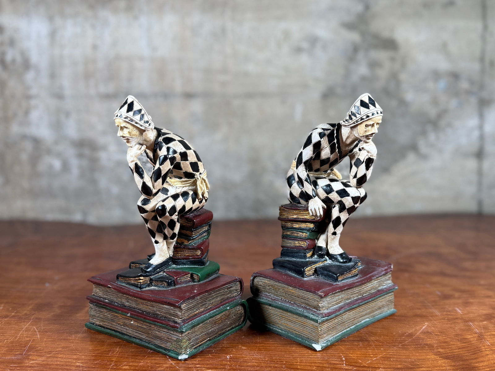 FRENCH ART DECO HARLEQUIN JESTER BOOKENDS: This lot features a pair of French Art Deco style harlequin jester bookends. Some wear throughout as shown in photos.