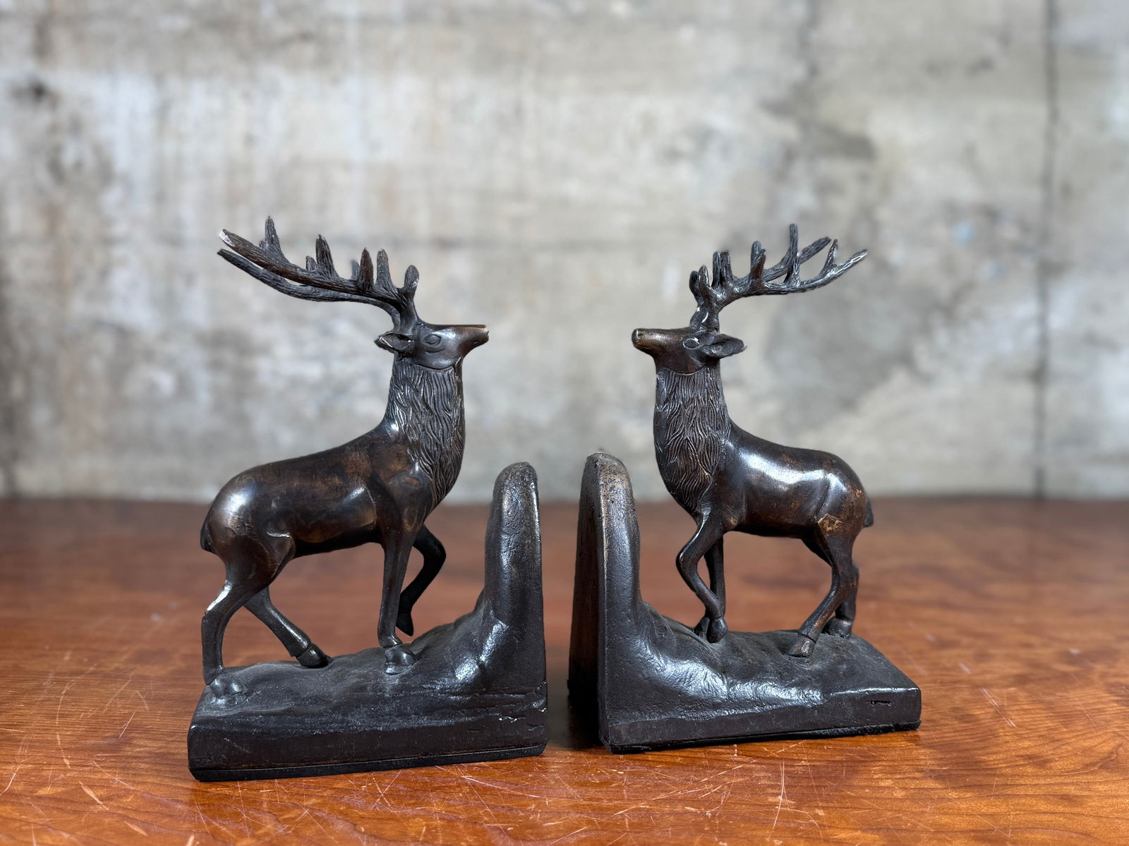 BRONZE ELK/STAG BOOKENDS: This lot features a pair of vintage bronze elk/stag bookends in very good condition.
