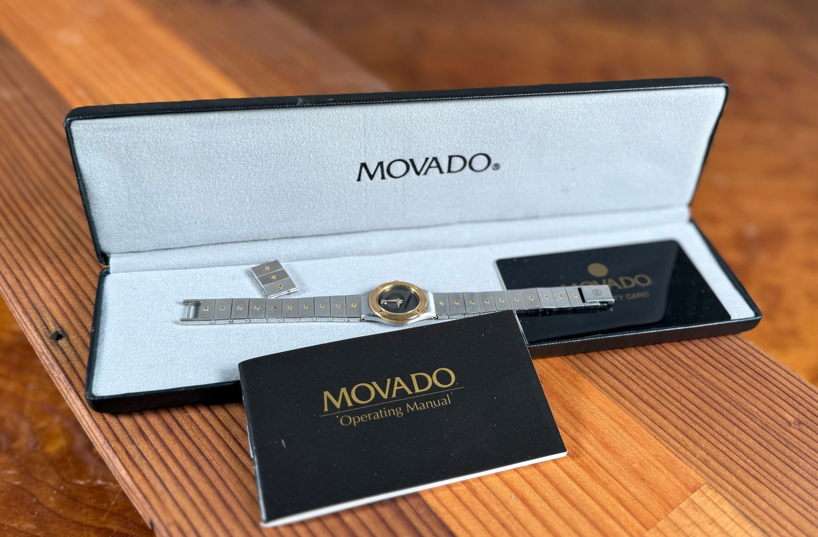 MOVADO, QUARTZ WATCH #1: This lot features a vintage Movado quartz watch with a 24mm case. Comes with the original case, warranty card, and purchase receipt. Service history unknown, will need a new battery at the minimum to