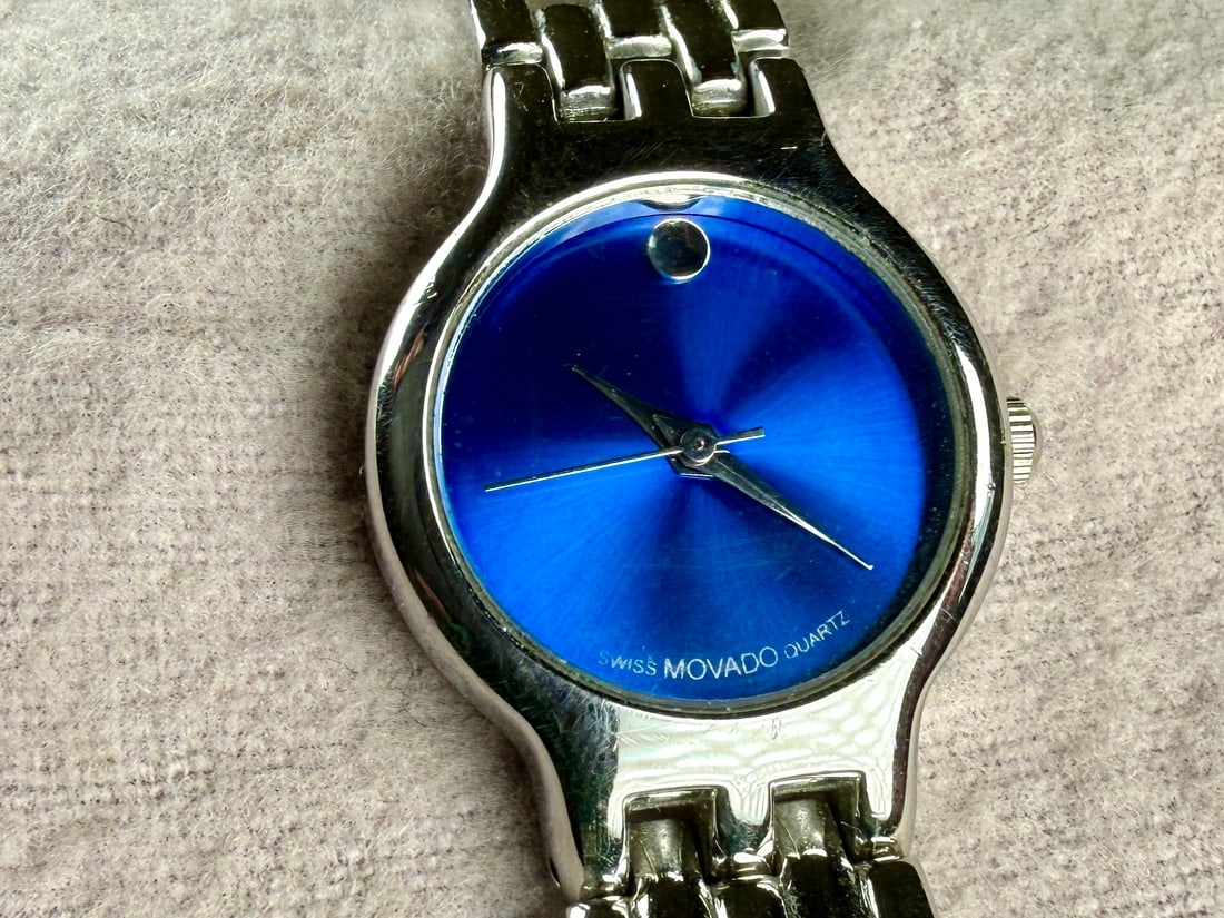 MOVADO, QUARTZ WATCH #3: This lot features a vintage Movado quartz watch with a 24mm case. Service history unknown and will need a battery at the minimum to run.