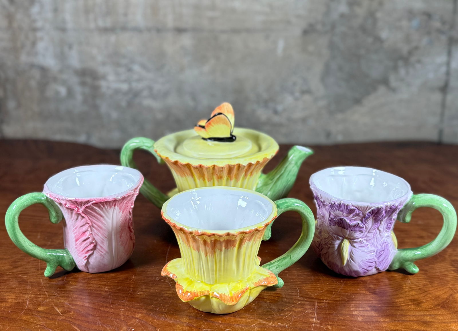 CERAMIC TEA SET WITH BUTTERFLY & FLORAL THEME: This lot features a decorative ceramic tea set with a butterfly/floral theme. All items appear to be in very good condition.