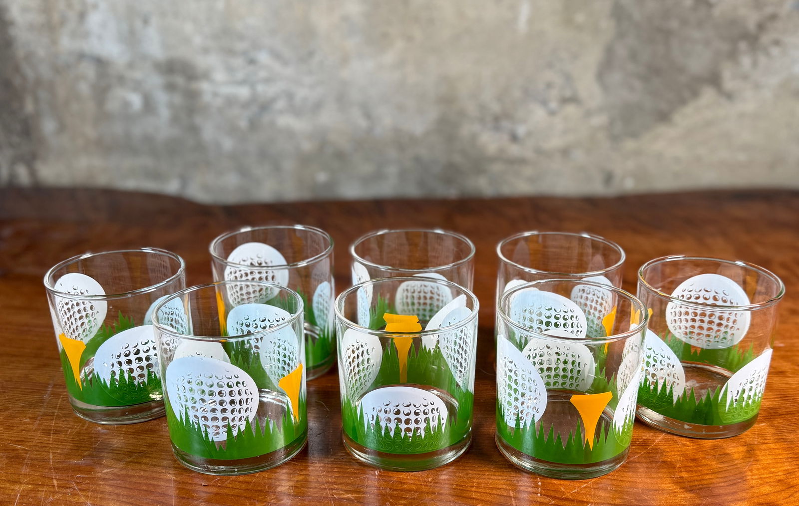 LIBBEY GLASS COMPANY, GOLF-THEMED 'ON THE ROCKS' GLASSES: This lot features a set of eight (8) vintage “on the rocks” golf-themed glasses by Libbey. All eight come in very good condition.