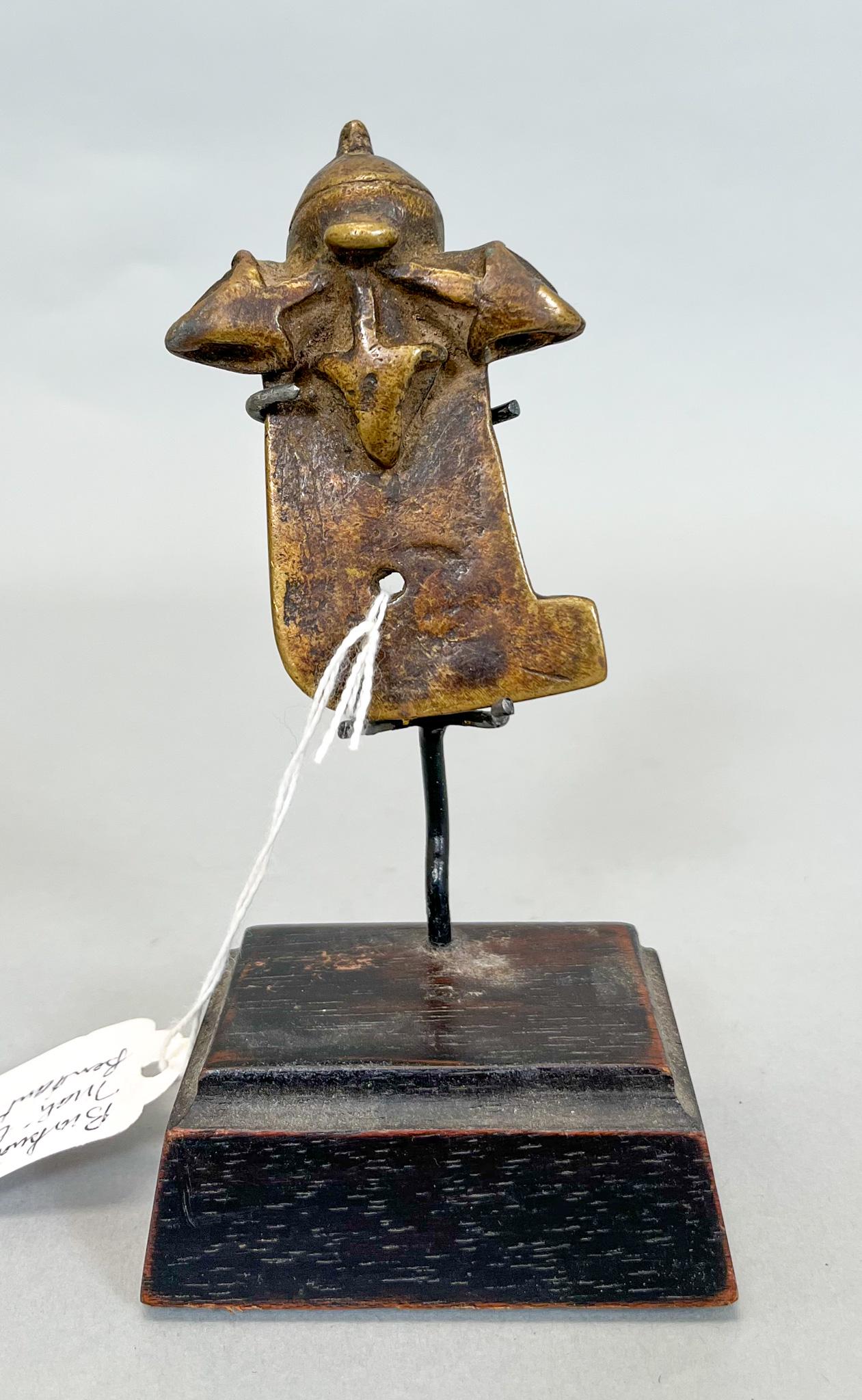 African, Burkina Faso/ Mali, Brass Pendant: Burkina Faso/ Mali, brass pendant, with stand, aged patina, 3.25"h x 2"w PROVENANCE:From the estate of Professor Philip Gould, New York