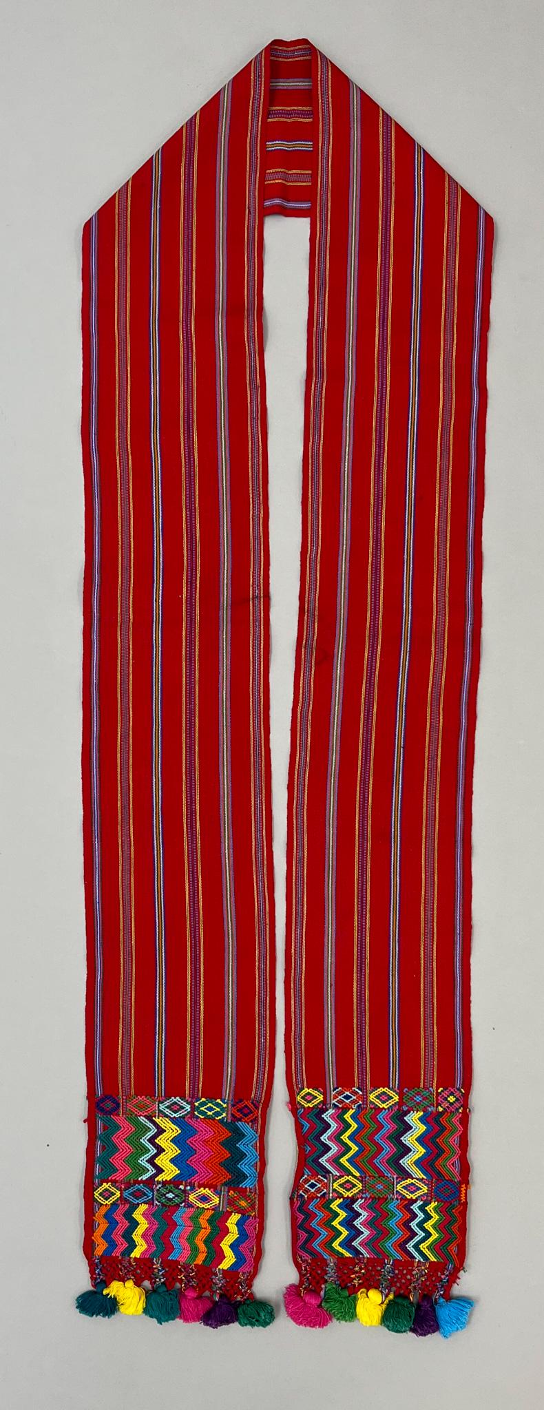 Colotenanago, Huehuetenango Department, Guatemala,Vintage Woven Cotton Women"s "Faja" Sash with: Colotenanago, Huehuetenango Department, Guatemala, vintage woven cotton women"s "Faja" sash, traditional red with assorted color stripe, tassels, and symbolic embroidery pattern on each end, 92"l x 6"