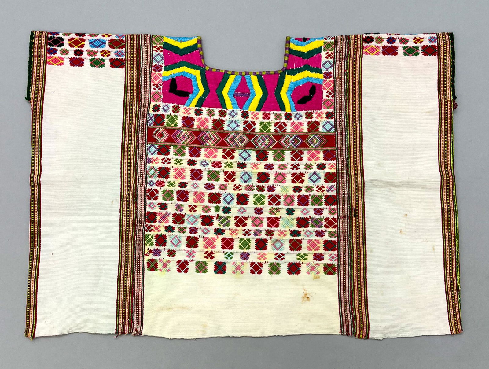 San Ildefonso Ixtahuacan, Huehuetenango Department, Guatemala, Vintage Woven Cotton "Huipil" Tunic: San Ildefonso Ixtahuacan, Huehuetenango Department, Guatemala, vintage woven undyed cotton "Huipil" tunic with stripes, multicolor geometric pattern, 20"l x 28"w PROVENANCE:From the estate of Professo