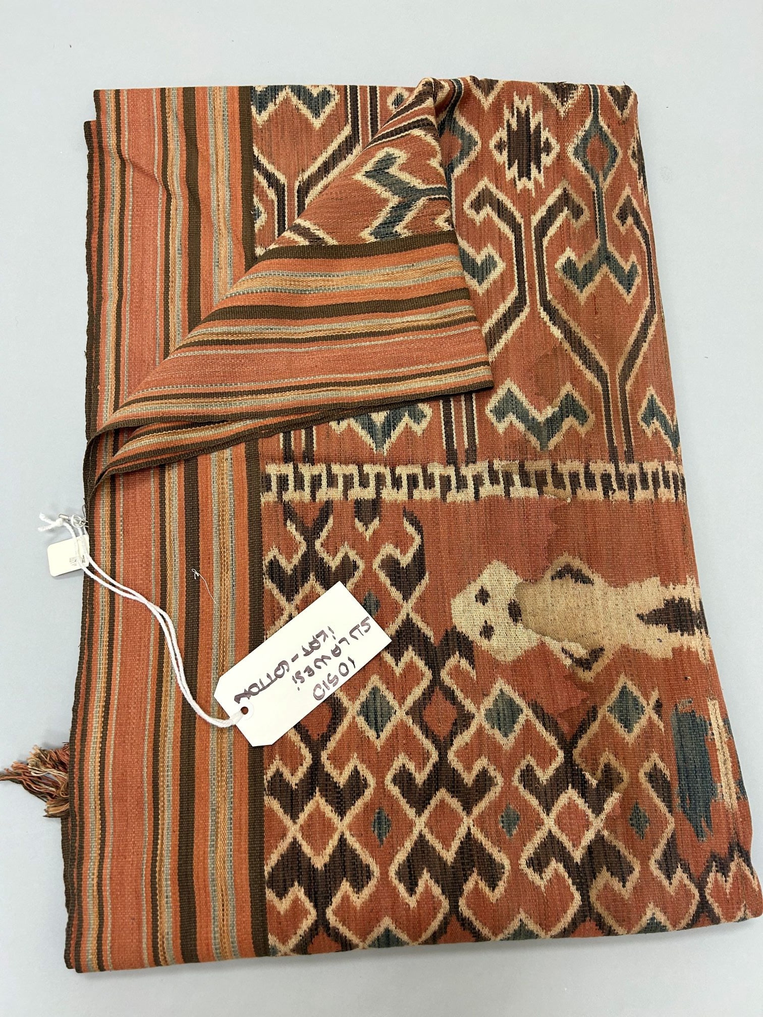 Indonesia, Sulawesi, Trodjan people Ikat Coarse Cotton Textile: Indonesia, Sulawesi, Trodjan people, ikat coarse cotton textile, 140"l X 40"w Provenance: From the estate of Dr. Philip Gould , New York