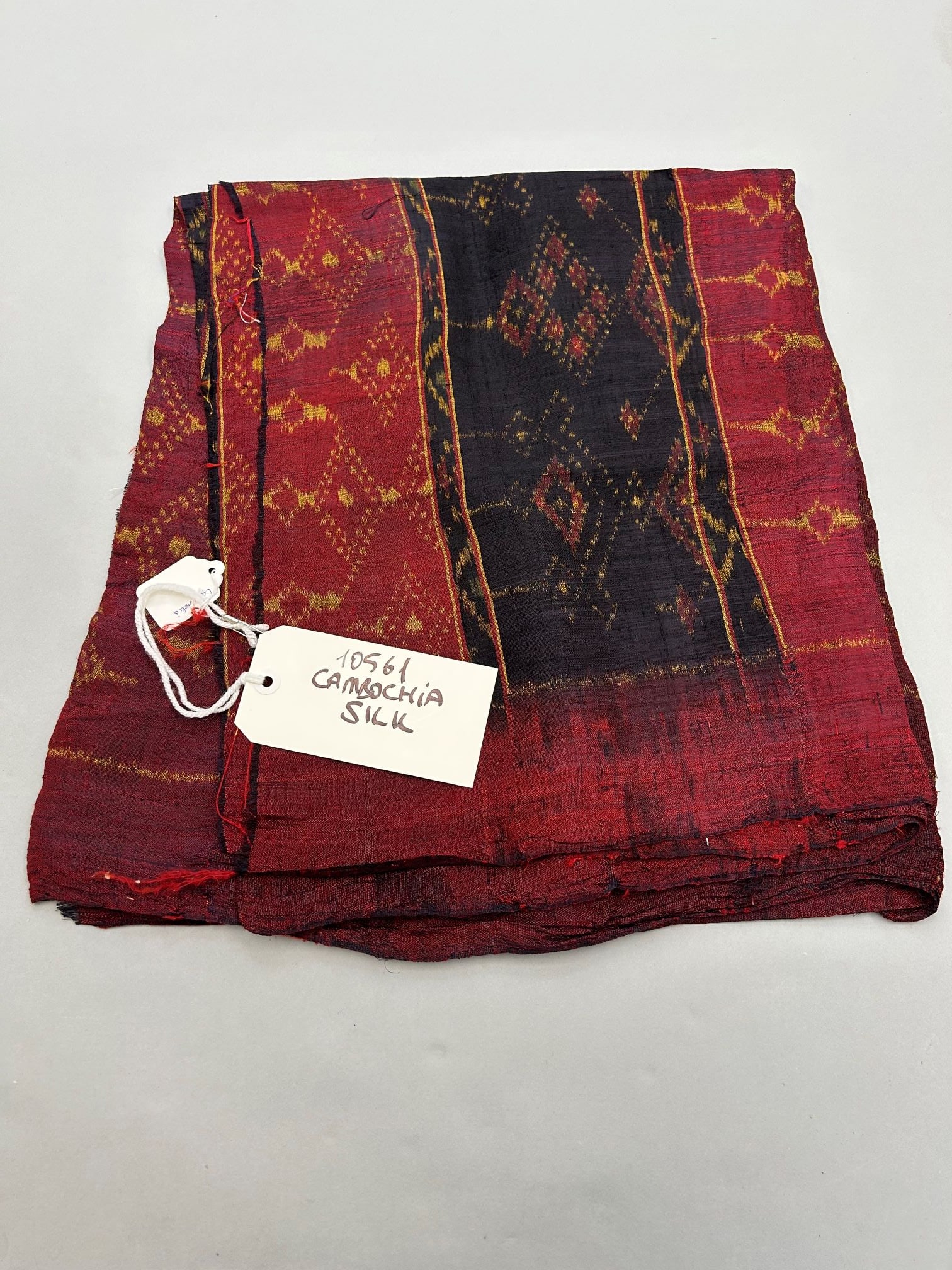 Cambodia, Silk Textile: Cambodia, silk textile, 71" at its longest point, 57" at shortest point, width varies between 38" and 36" Provenance: From the estate of Dr. Philip Gould , New York