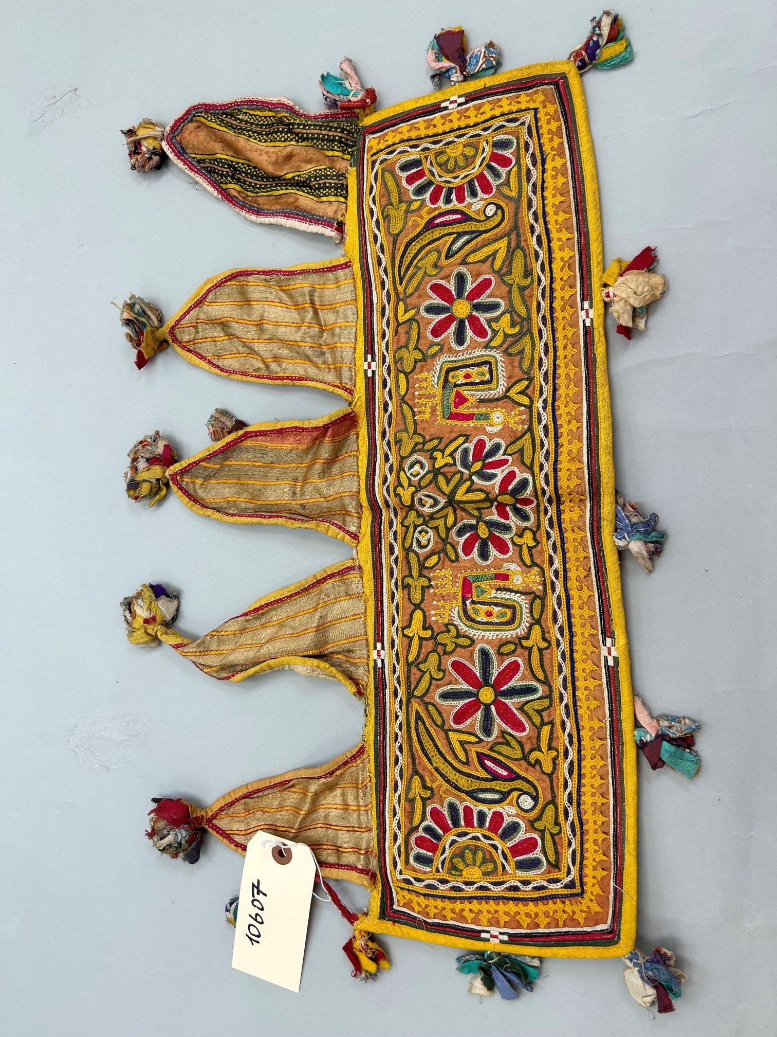 India, Embroidered Cotton and Silk Accessory: India, embroidered cotton and silk accessory, 22"l x 12"w Provenance: From the estate of Dr. Philip Gould , New York