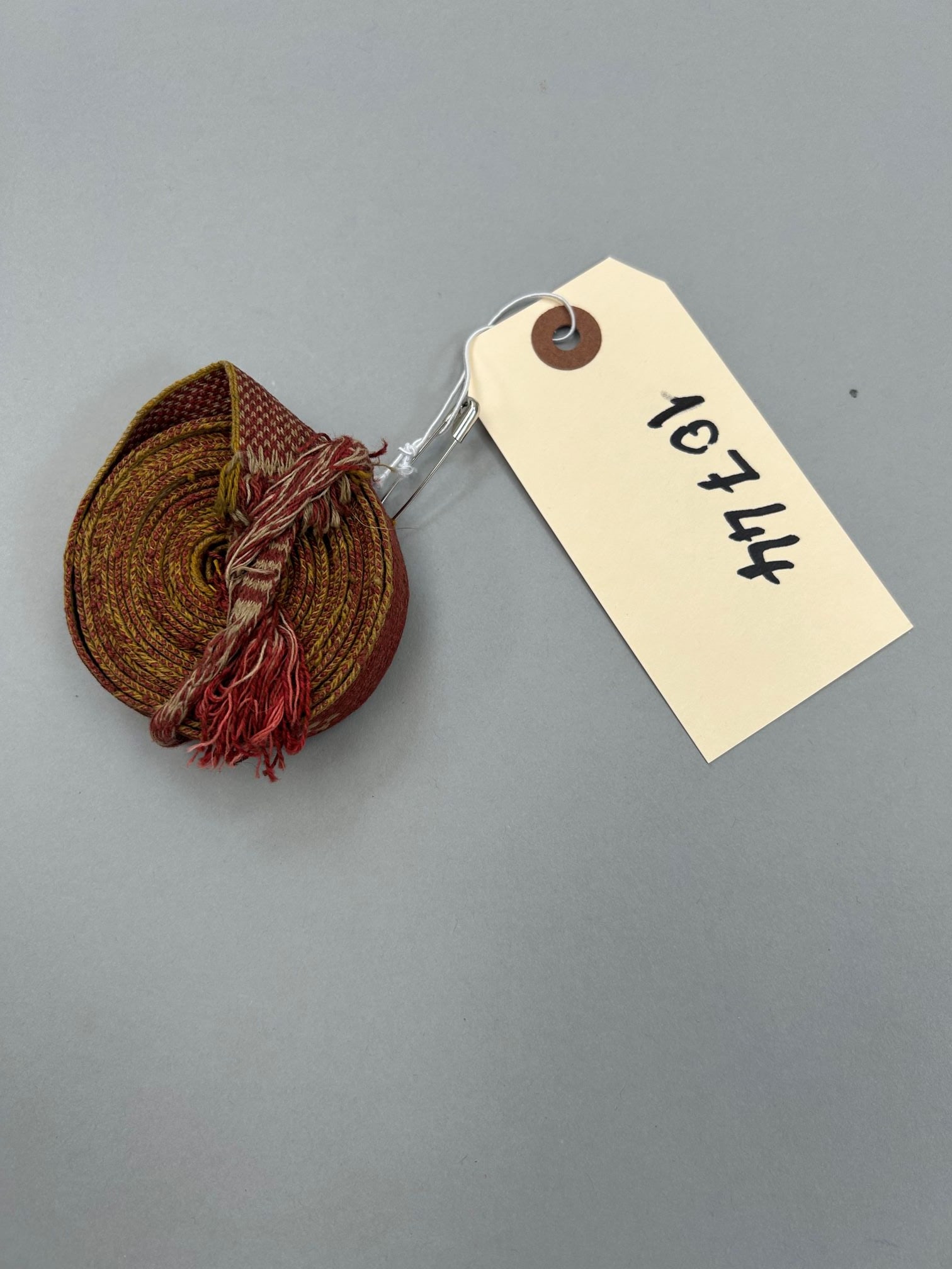 Myanmar, Burmese Cotton Calender Ribbon: Myanmar, Burmese cotton calender ribbon, 96"l x 1"w Provenance: From the estate of Dr. Philip Gould , New York